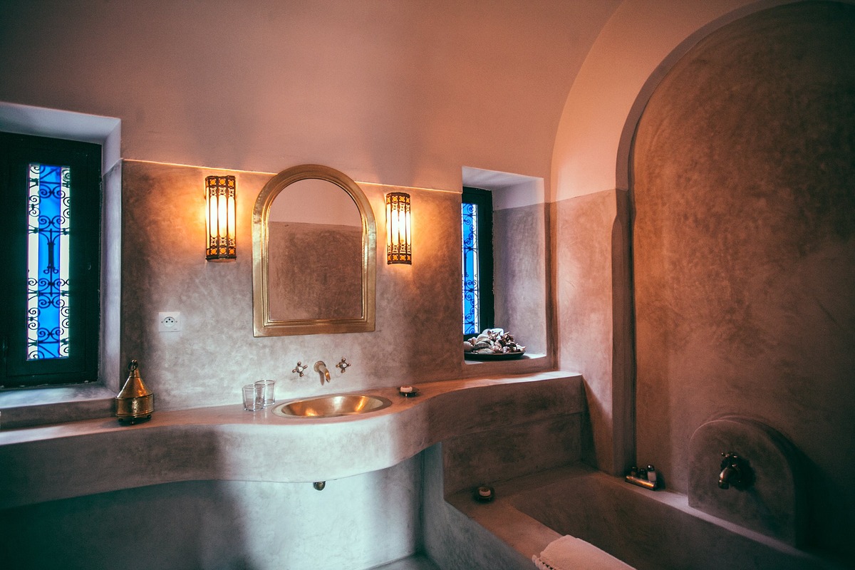luxury bathroom with low lighting, spa style bathroom